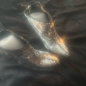 Michael Antonio silver boots size 9.